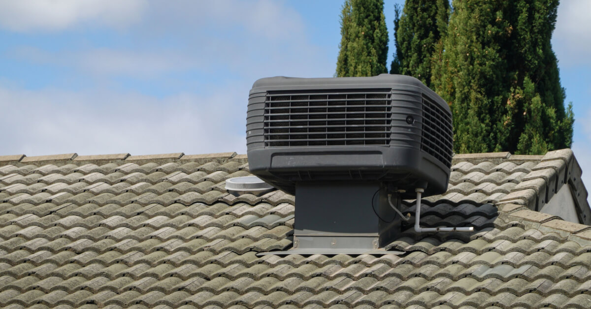 Older Style Evaporative Cooler on Roof of House